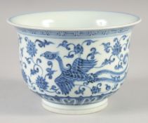 A CHINESE BLUE AND WHITE PORCELAIN PHOENIX BOWL, the base with six-character mark, 16cm diameter.