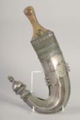 AN OMANI JAMBIYA DAGGER WITH ALL-SILVER SCABBARD and horn handle, 31.5cm long.