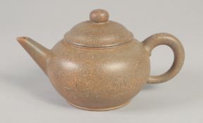 A CHINESE YIXING TEAPOT, with calligraphy, impressed trade mark to base, 19.5cm spout to handle.