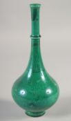 A CHINESE GREEN GLAZE LONG-NECK VASE, with incised decoration, four-character mark to base, 22cm