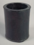 A CHINESE HARDWOOD BRUSH POT, possibly zitan, 12.5cm high.
