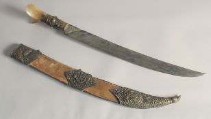 A 20TH CENTURY OTTOMAN HORN HILTED REPRODUCTION YATAGHAN SILVER SWORD, and brass and velvet overlaid
