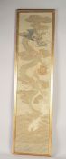 A EARLY 20TH CENTURY JAPANESE DRAGON PANEL, framed and glazed, textile 114cm x 27.5cm.