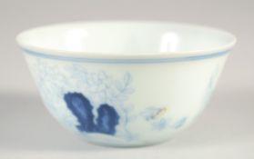 A CHINESE BLUE AND WHITE CHICKEN CUP, six-character mark to base, 8cm diameter.