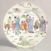 A CHINESE FAMILLE ROSE PORCELAIN PLATE, decorated with the Eight Immortals, 10in diameter.