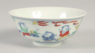 A CHINESE DOUCAI PORCELAIN CUP, decorated with boys, the base with six-character mark, 8.5cm