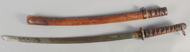 A 20TH CENTURY JAPANESE TACHI, with leather bound grip and scabbard with decorative mounts, sword