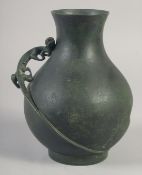 A CHINESE BRONZE VASE WITH RELIEF CHILONG, indistinct mark to base, 23cm high.