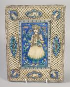 A FINE 19TH CENTURY PERSIAN QAJAR GLAZED POTTERY TILE, depicting an archer, 28cm x 21cm.
