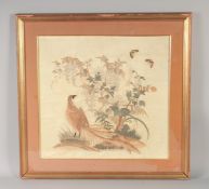 A 19TH CENTURY CHINESE SILK PANEL, of a bird and flora with butterflies, framed and glazed,