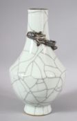 A GOOD CHINESE CRACKLE GLAZED VASE, with moulded dragon to the neck. 23cm high.