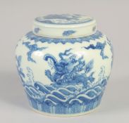 A CHINESE BLUE AND WHITE GINGER JAR AND COVER, decorated with mythological beasts, 12cm high.