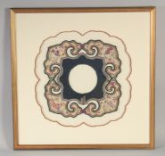 A 19TH CENTURY CHINESE WOMAN'S CLOTHES ACCESSORY / COLLAR, framed and glazed, 53.5cm square.