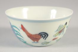 A CHINESE DOUCAI PORCELAIN CHICKEN CUP, six-character mark to base, 8cm diameter.