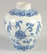 A CHINESE BLUE AND WHITE PORCELAIN POT, decorated with lotus and vine, six-character mark to base,