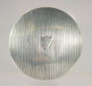 A SMALL DUTCH SILVER REEDED CIRCULAR SNUFF BOX. 1.75ins diameter.