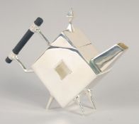 A CHRISTOPHER DRESSER STYLE SILVER PLATED SQUARE TEA POT.