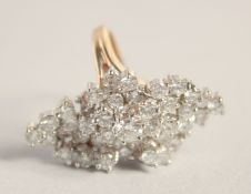 A GOOD 18CT GOLD DIAMOND SET MARQUESE RING set with about 40 diamonds.