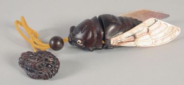 A JAPANESE CARVED WOOD AND MOTHER OF PEARL DRAGON FLY INRO. Signed with toggle. 4.5ins long.