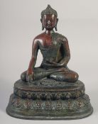 A LARGE BRONZE SEATED BUDDHA. 12ins long.