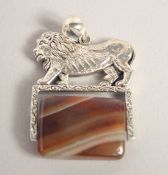 A SILVER AND AGATE LION FOB SEAL.