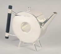 A CHRISTOPHER DRESSER STYLE SILVER PLATED CIRCULAR TEA POT.