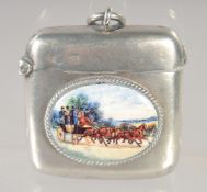 AN EDWARD VII SILVER PLAIN VESTA CASE with an oval enamel of coach and horses. 1.5ins x 1.5ins.