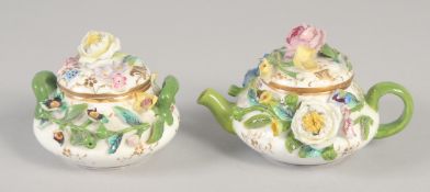 A 19TH CENTURY ENGLISH PORCELAIN MINIATURE FLORAL ENCRUSTED TEAPOT AND COVER AND A MATCHING