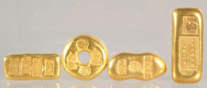 FOUR GILDED METAL BARS.