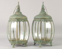 A PAIR OF BULBOUS COPPER STORM LANTERNS 18ins high.