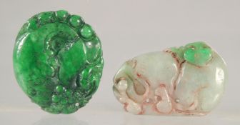 TWO CARVED JADE PENDANTS.