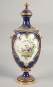 A ROYAL WORCESTER LARGE VASE painted with exotic birds in landscape on a cobalt blue ground in the