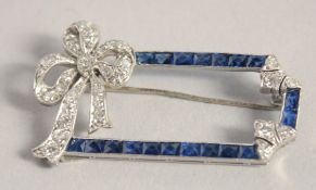 A GOOD PLATINUM DIAMOND AND SAPPHIRE DECO BOW BROOCH.