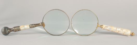TWO MAGNIFYING GLASSES with mother of pearl handles.