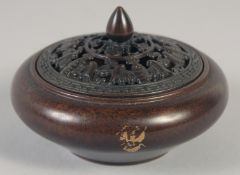 A CHINESE CIRCULAR BRONZE GOLD SPLASH CENSER AND COVER. 3.75ins diameter.