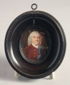 AN OVAL PORTRAIT MINIATURE OF JOHN CHANDLER, 18TH CENTURY. 2ins x 1.5ins in a turned pearwood frame.