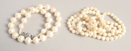 A LONG PEARL NECKLACE. 27ins and another. 15ins long (2).