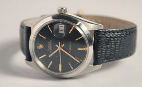 A GENTLEMAN'S ROLEX OYSTER DATE WRISTWATCH with black dial and leather strap.
