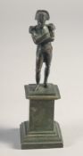 A SMALL BRONZE FIGURE OF NAPOLEON on a pedestal. 4.25ins high.
