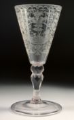 AN 18TH - 19TH CENTURY GERMAN GLASS with facet stem, the bowl engraved with a deer hunt. 7.25ins
