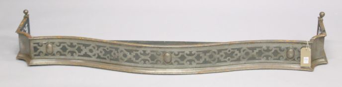 A GEORGIAN PIERCED STONE SERPENTINE FRONTED FENDER. 4ft 10ins long, 1ft deep.