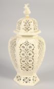 A LATE 19TH CENTURY LEEDS CREAMWARE VASE AND COVER, the body having alternating pierced panels.