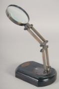 A MAGNIFYING GLASS on a stand. 9ins high.