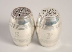 A SMALL PAIR OF VICTORIAN BAROQUE SHAPED SALT AND PEPPERS. 2.125ins high. Edinburgh 1881. Maker: