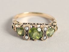 A GOOD 9CT GOLD PERIDOT AND PEARL RING.