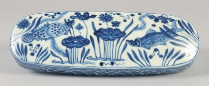 A CHINESE BLUE AND WHITE PORCELAIN SCRIBES BOX, decorated with fish and aquatic flora. 28cm long.