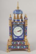 A BLUE CLOISONNE ENAMEL CLOCK with domed top and four pillars.