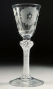 A GOOD JACOBEAN ROSE GLASS with air twist stem, the bowl engraved with a rose bud and leaves. 5.