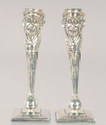 A PAIR OF SILVER PLATE JUDAICA CANDLESTICKS. 