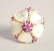 A SILVER MOTHER OF PEARL AND RUBY RING.